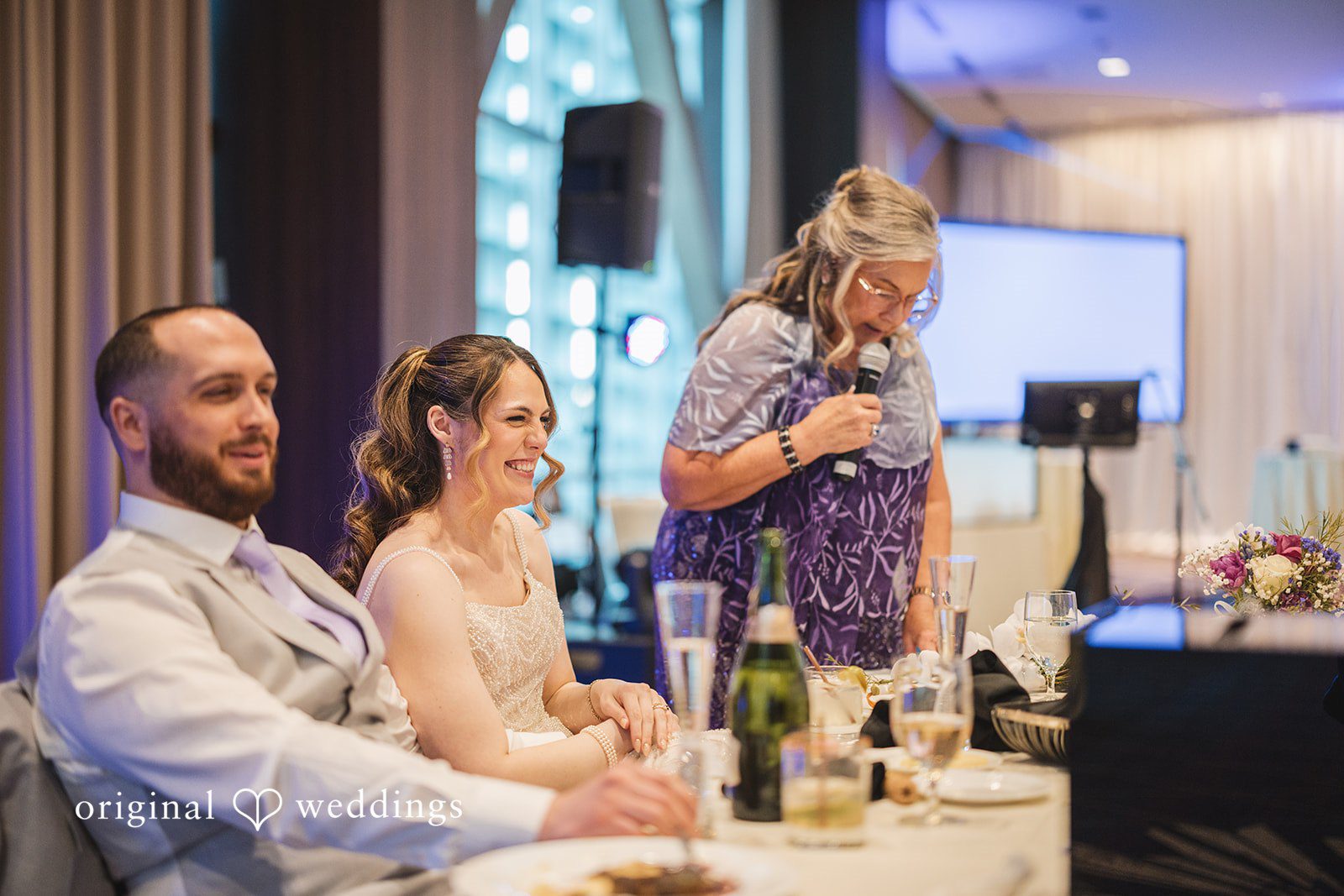 Nicolas + Nicole Bride and groom seated together at their reception table