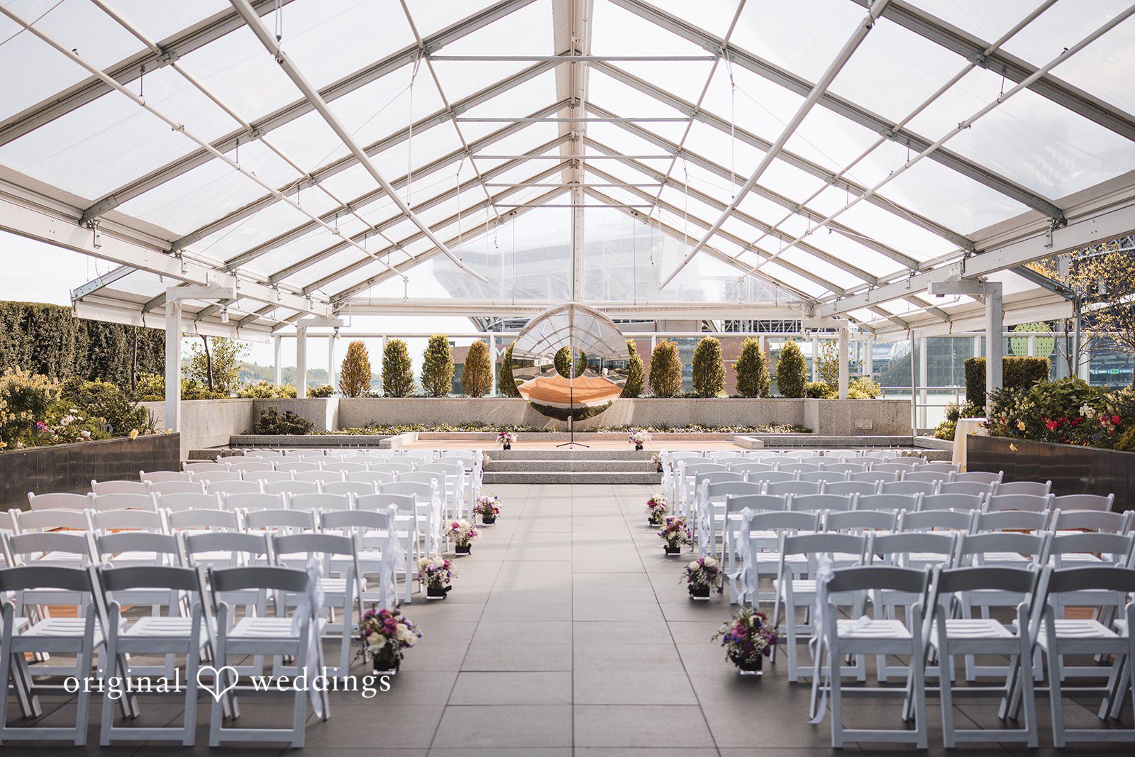 Nicolas + Nicole Wide view of the empty ceremony space before guests arrive