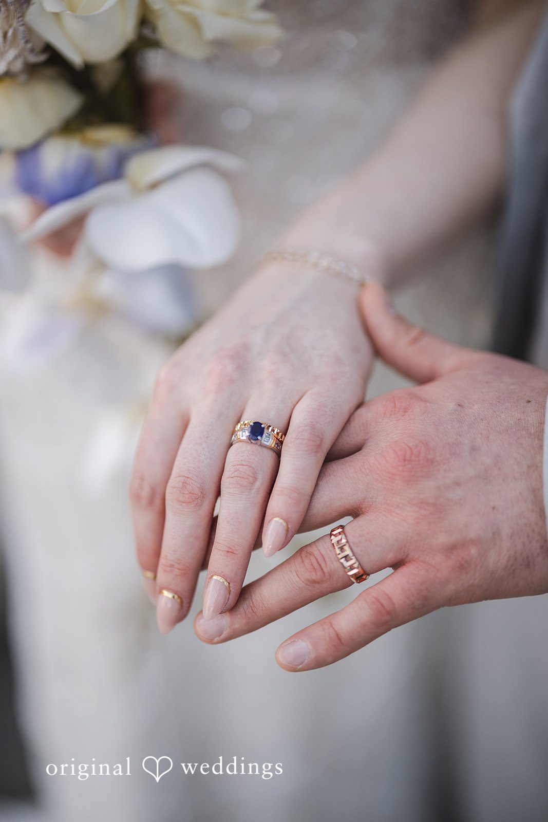 Nicolas + Nicole Close-up of the bride and groom holding hands