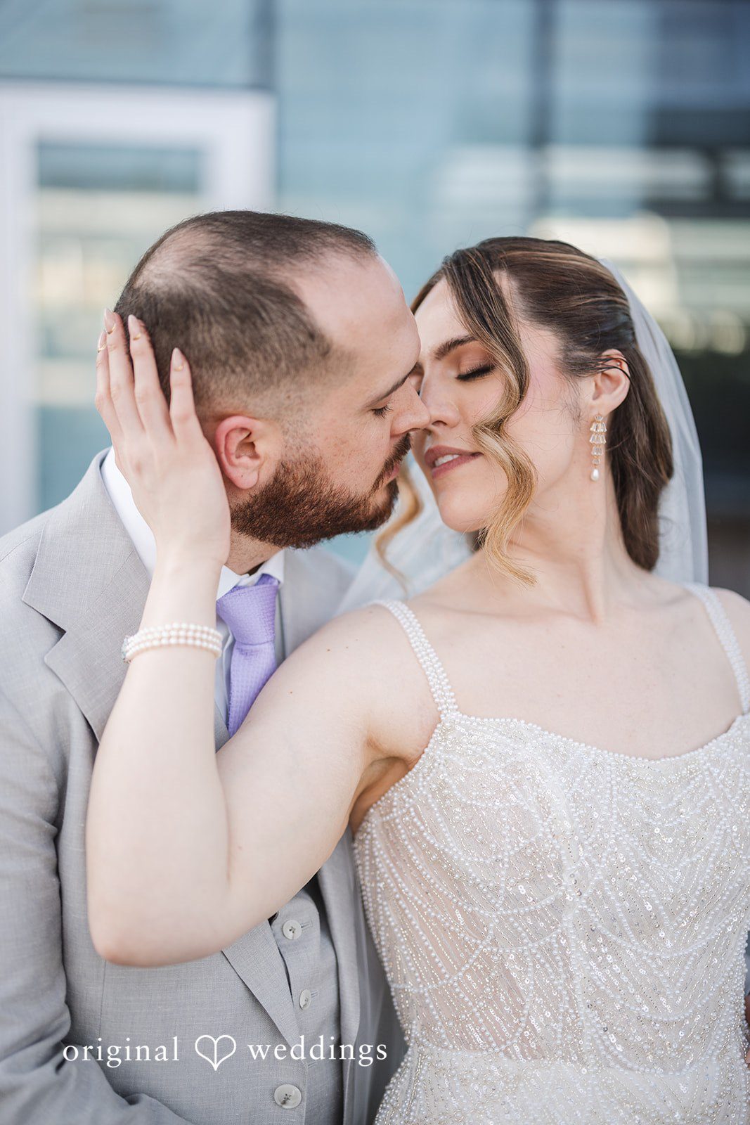 Nicolas + Nicole Bride and groom kissing during romantic wedding portraits