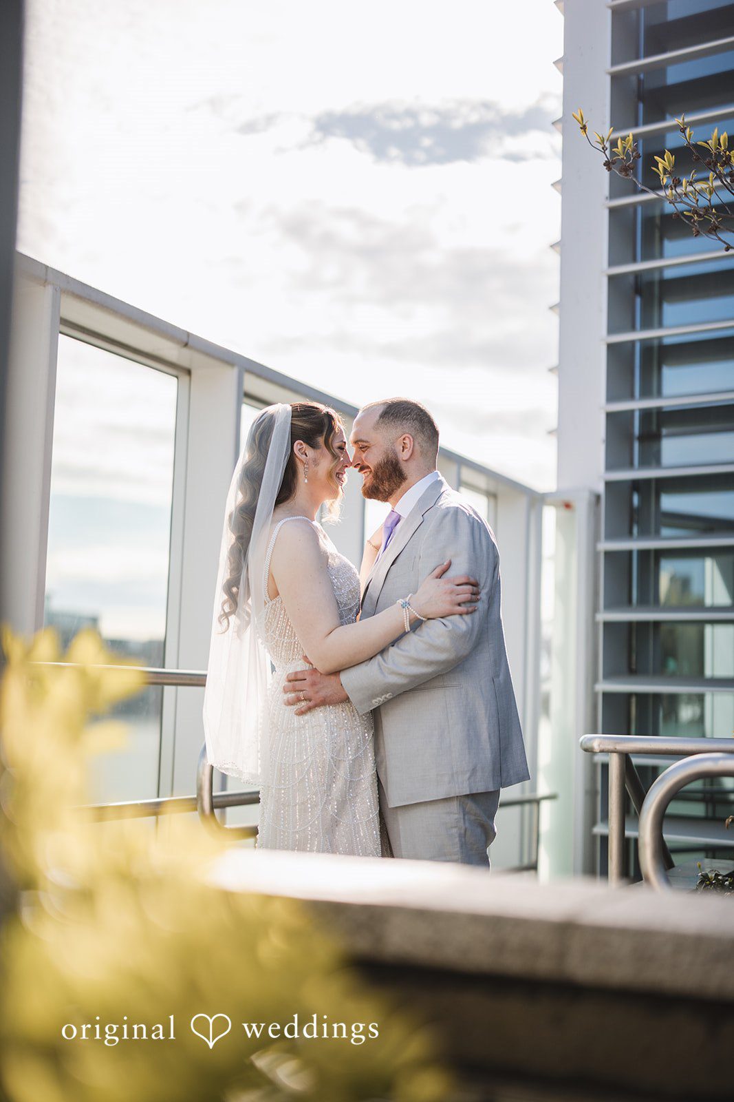 Nicolas + Nicole Couple embracing during wedding portraits together