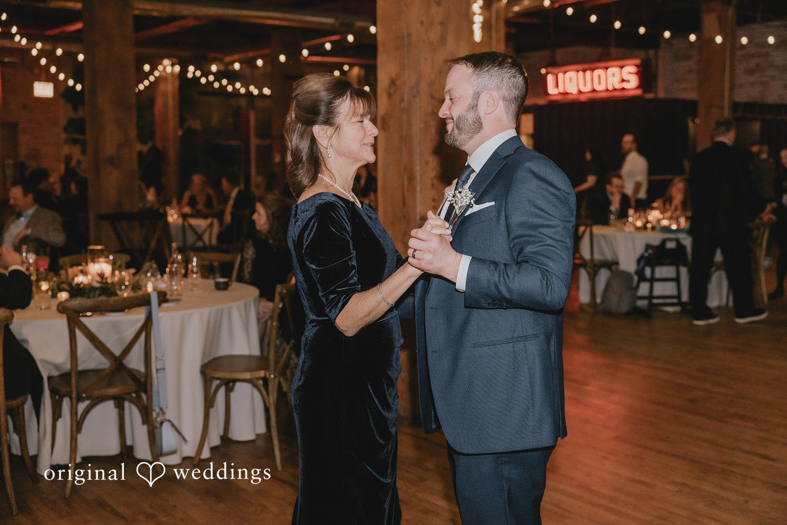 The groom dances with his mother