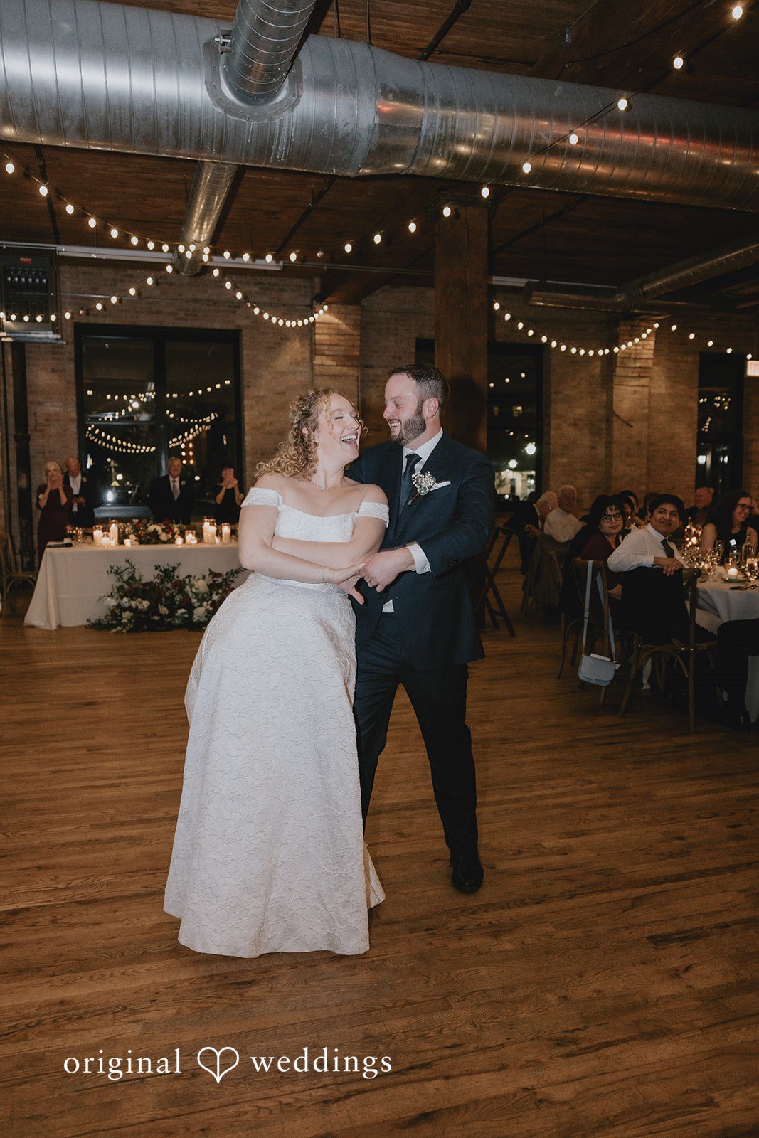 The couple takes their first dance at the Lacuna Lofts ballroom