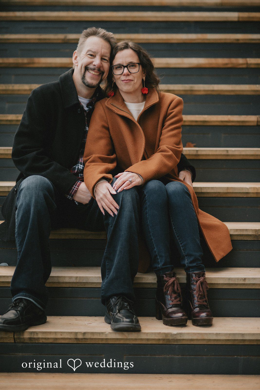 A beautiful portrait of the couple by the stairs at Lake Kittamaqundi