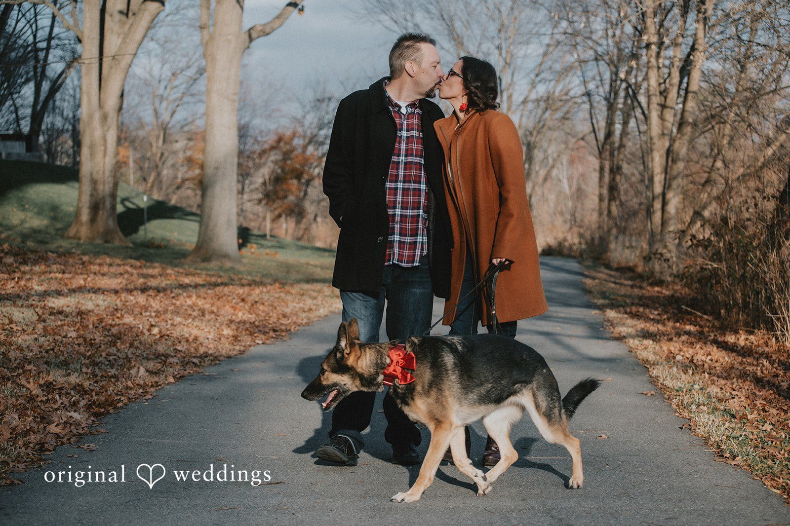 Our Baltimore engagement photographer at Original Weddings captured a romantic portrait of the couple and their pup at Lake Kittamaqundi