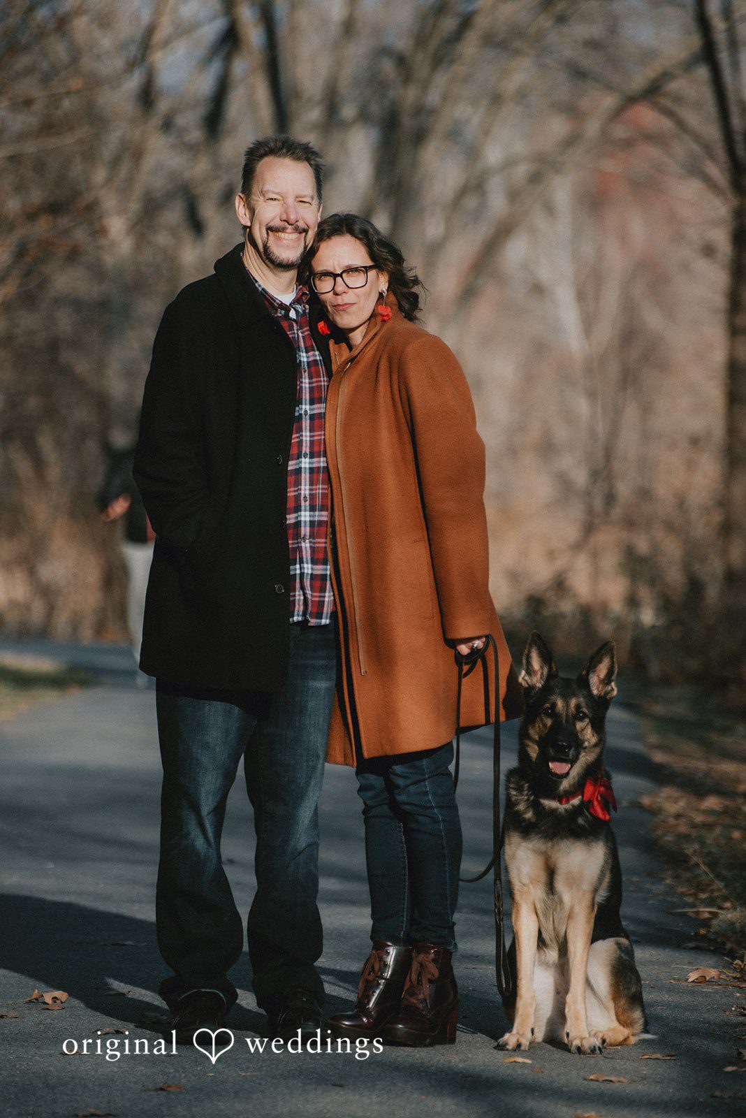 A stunning portrait of the couple and their adorable pup