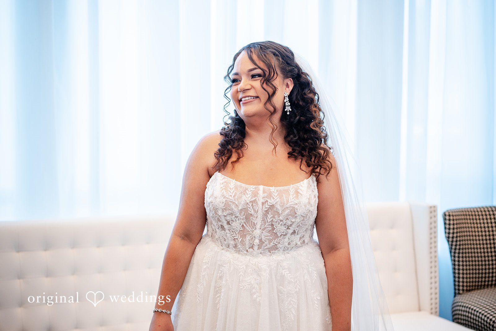 Bride getting ready before the ceremony in soft natural light