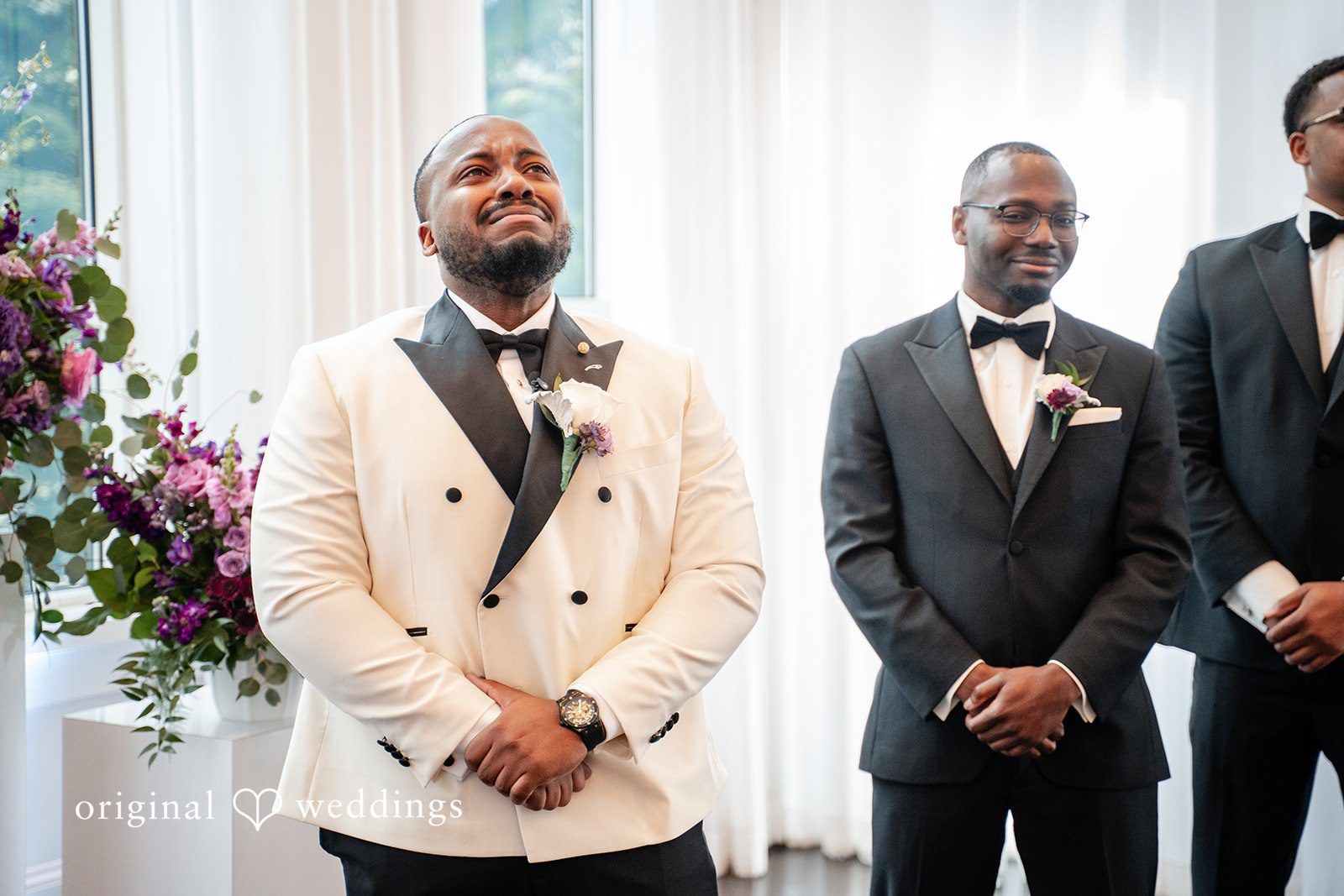 Groom waiting emotionally with tears in his eyes before the ceremony begins
