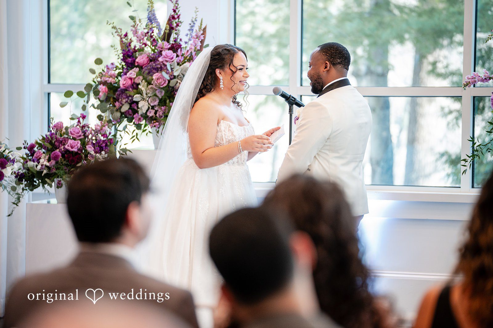 Couple reading their handwritten vows to each other