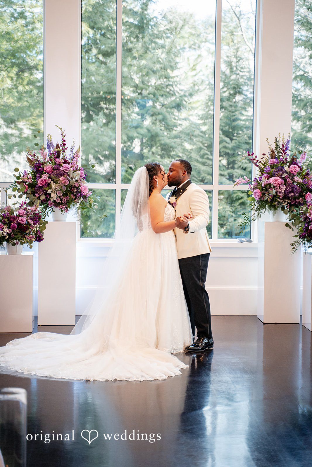 Romantic wedding kiss captured during the ceremony