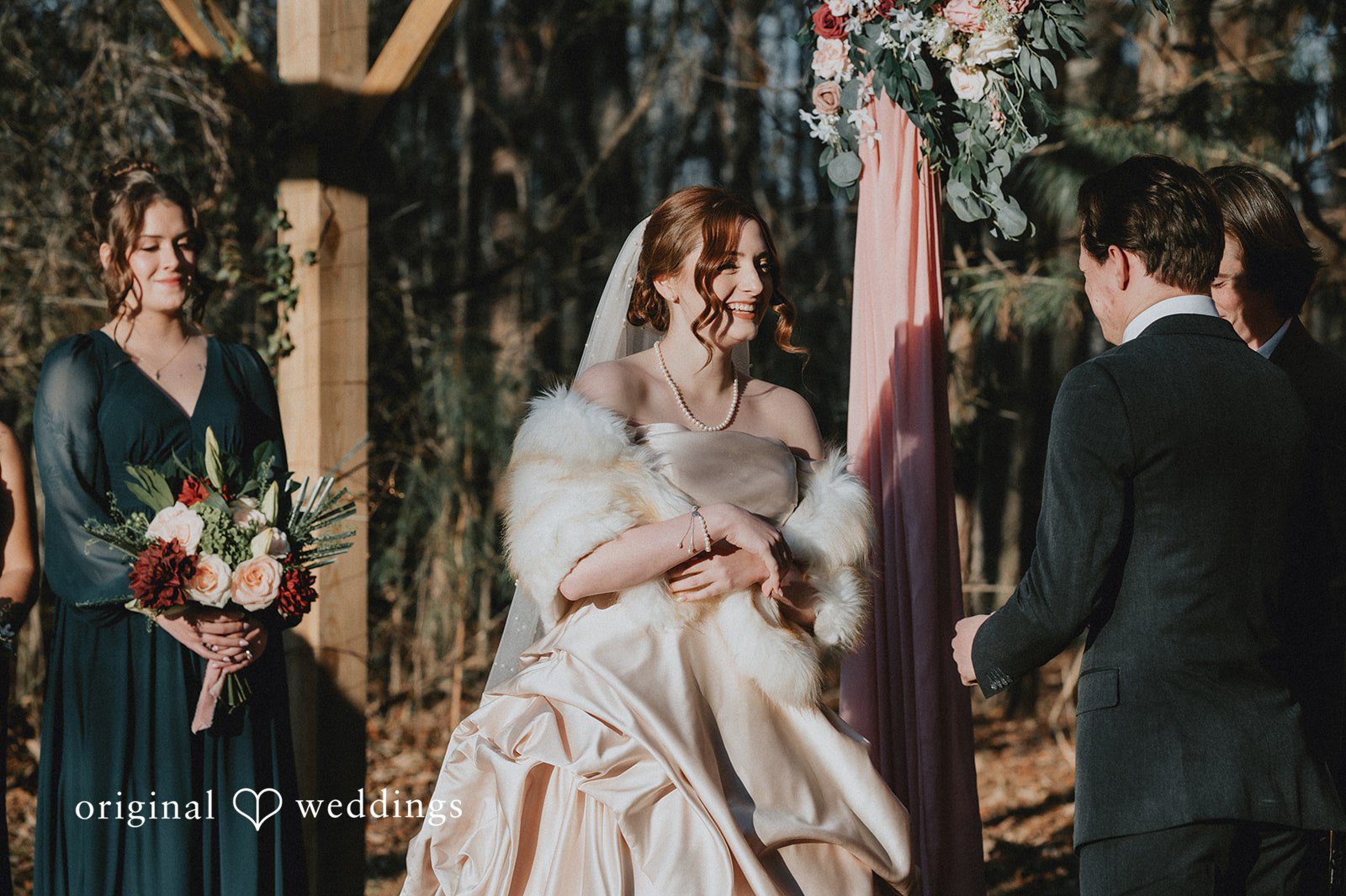 Ayana + Gabriel Bride wearing a fur shawl standing at the altar with the groom.