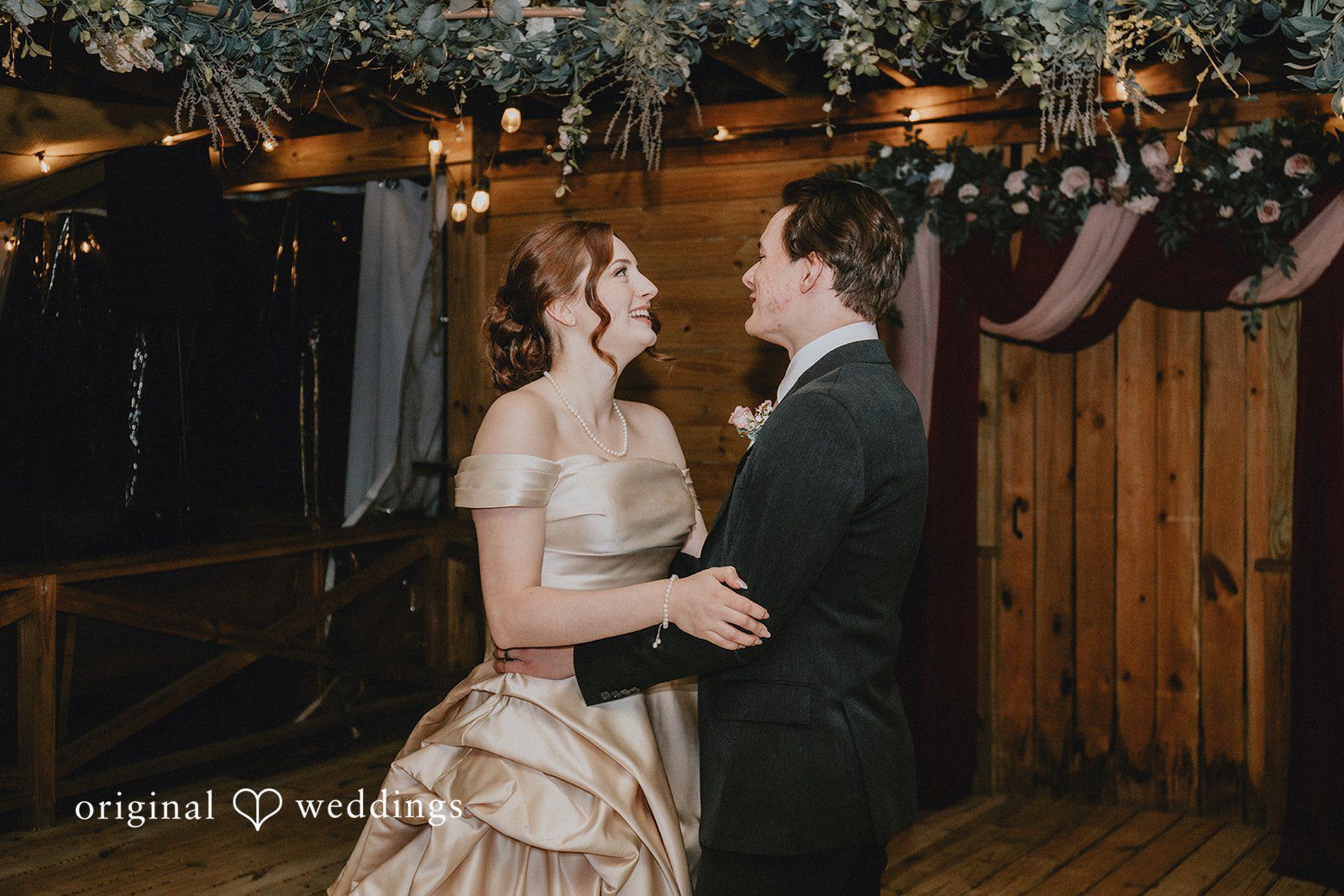 Ayana + Gabriel Bride and groom looking at each other lovingly during their wedding reception.