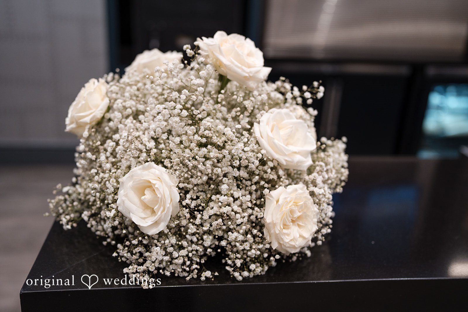 A bridal bouquet composed of white roses.