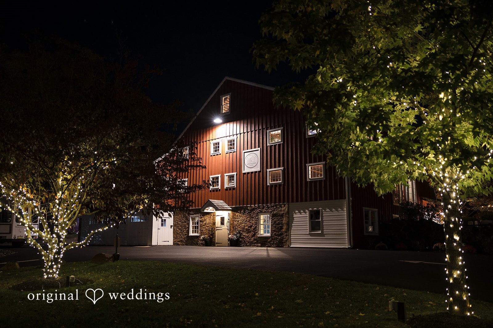 April + Joseph Romantic nighttime exterior of Lochwood Manor wedding venue