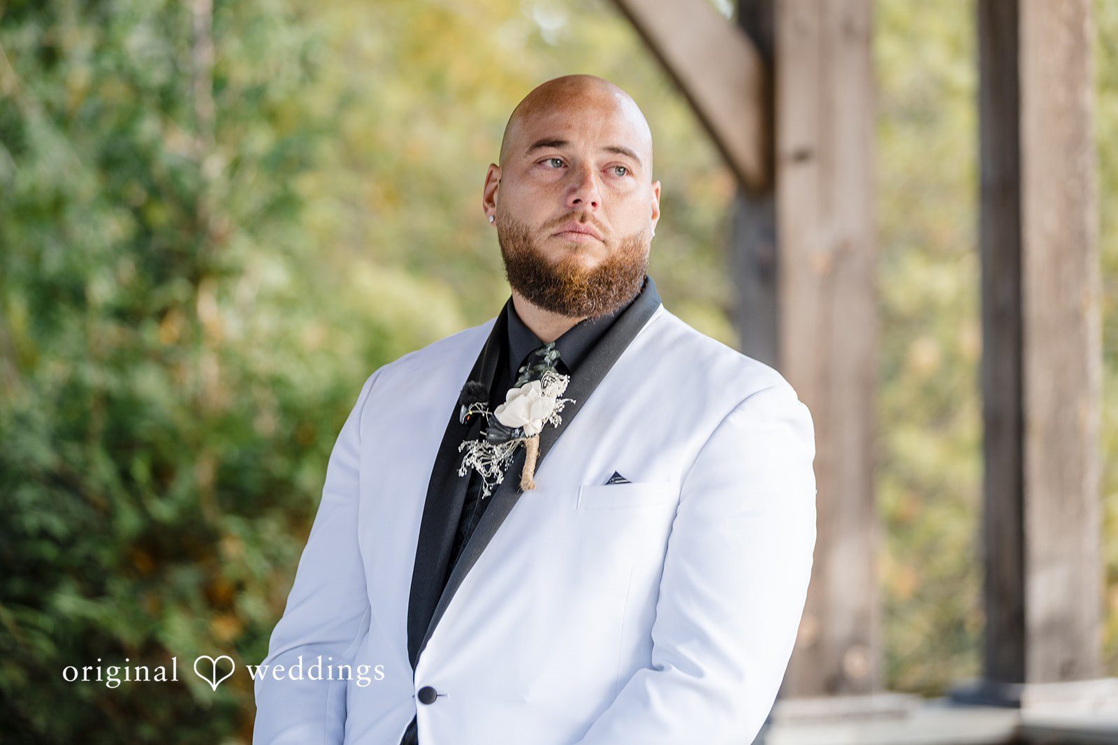 April + Joseph Elegant groom posing before wedding ceremony outdoors