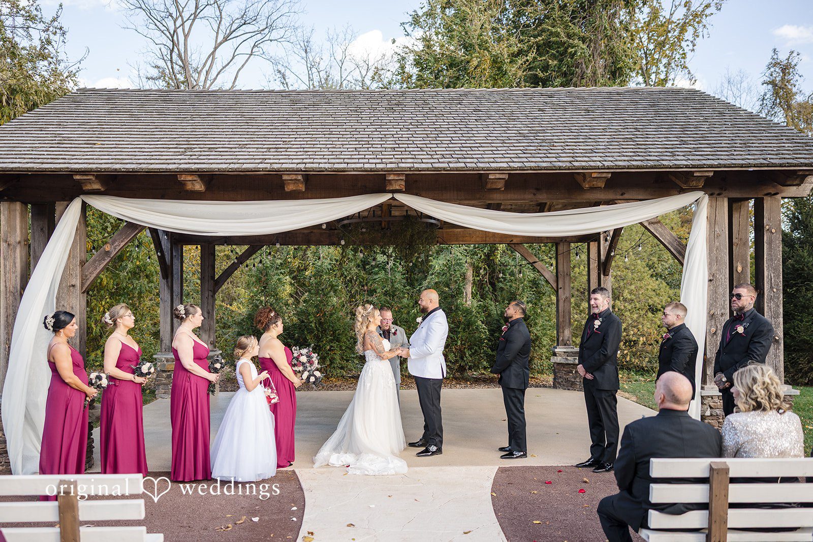 April + Joseph Wedding couple sharing a loving moment while holding hands at Lochwood Manor
