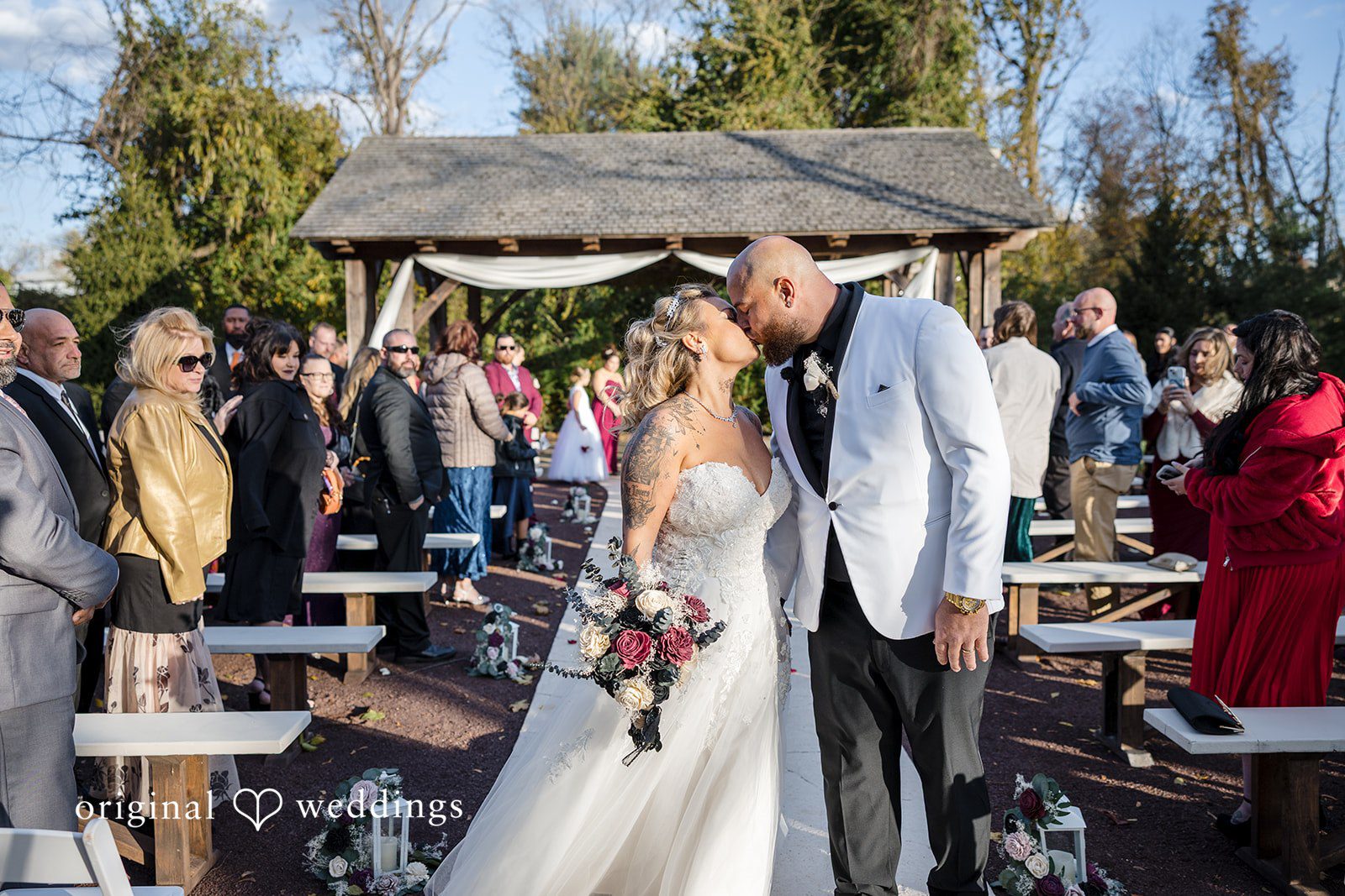April + Joseph Romantic moment of bride and groom kissing after the wedding ceremony