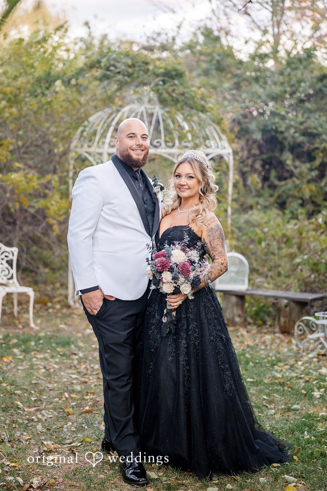 April + Joseph Romantic wedding portrait featuring bride in elegant black dress