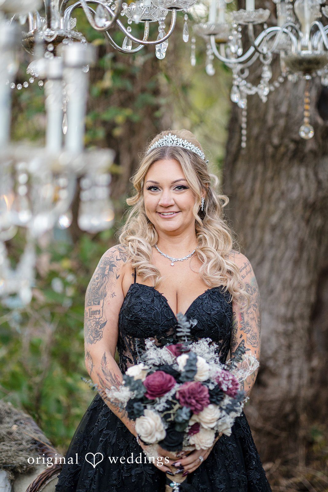 April + Joseph Bride posing with floral bouquet at Lochwood Manor