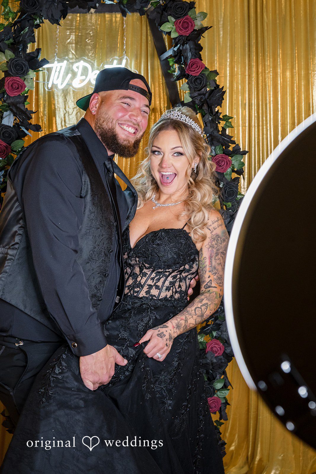 April + Joseph Happy newlywed couple smiling at wedding photo