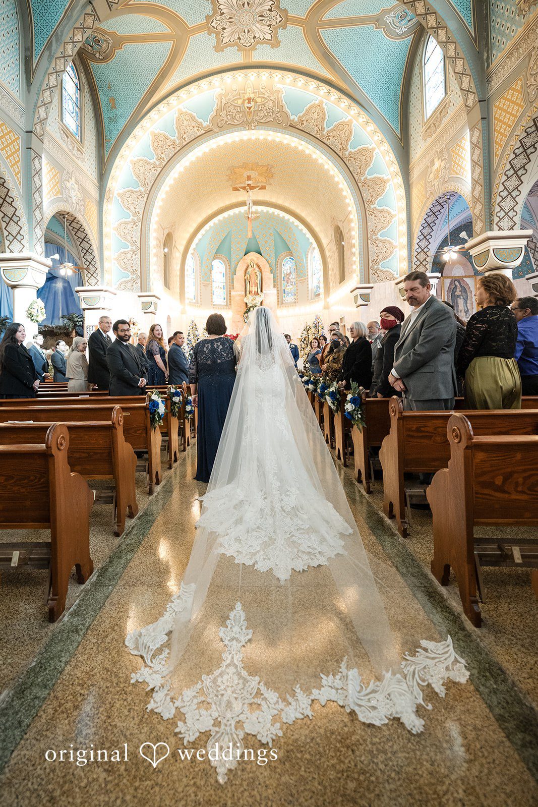 Bride walking down the aisle in her beautiful wedding gown