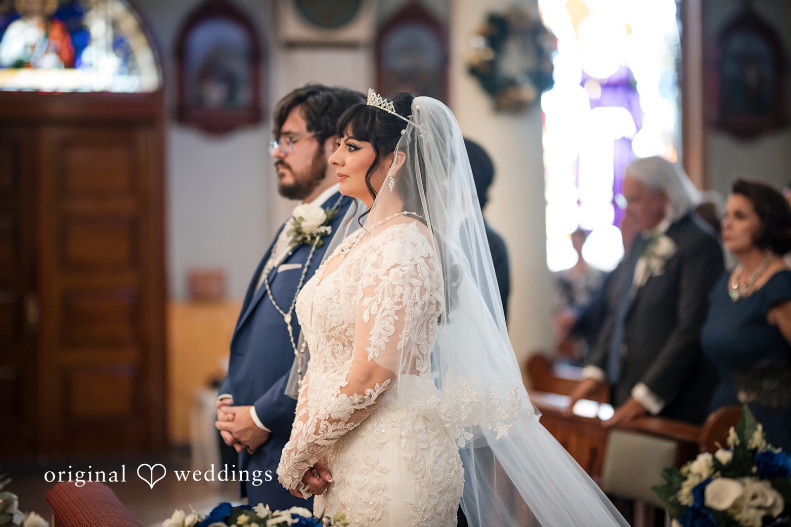 Lovely couple listening to the priest during wedding ceremony