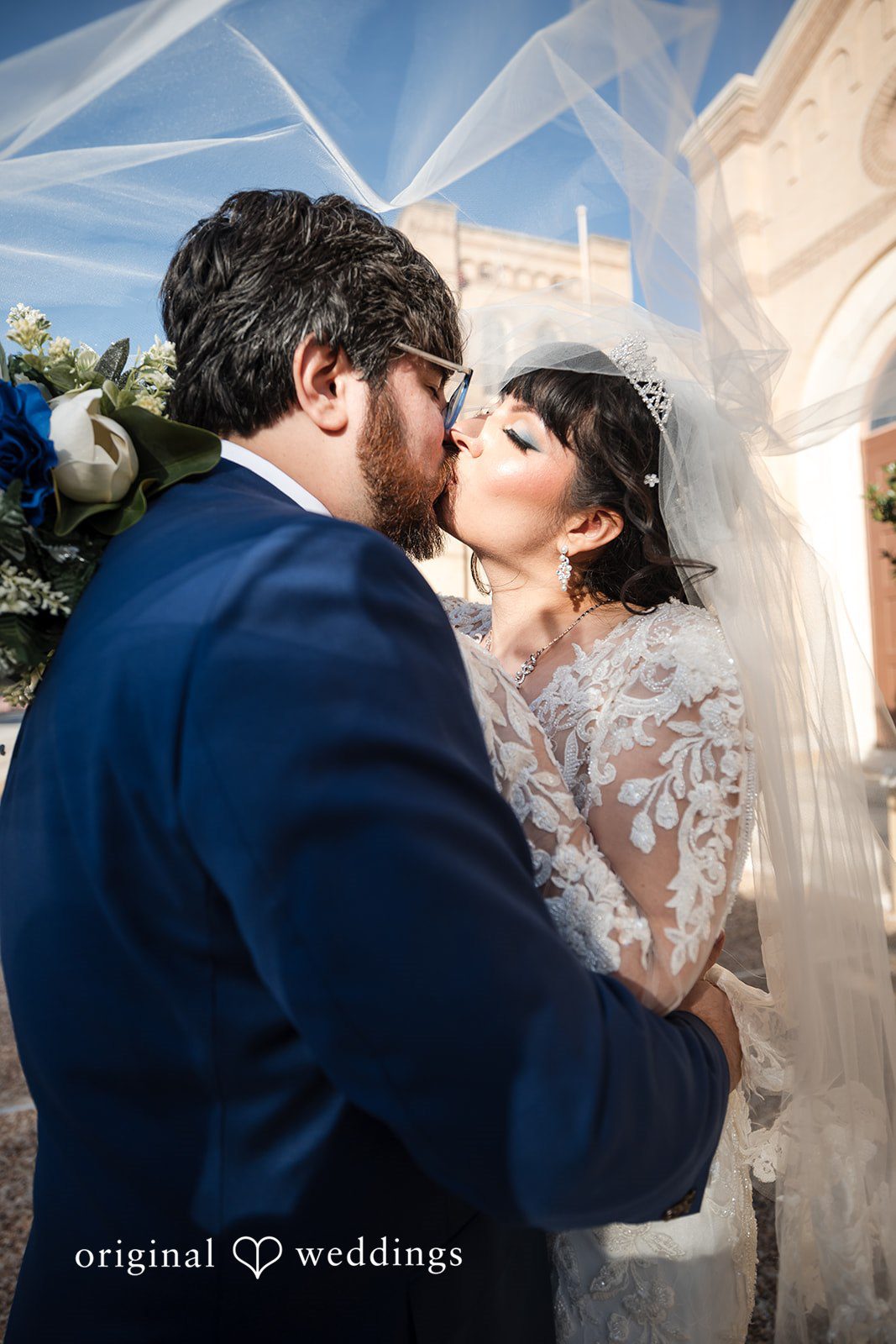 Romantic kiss of bride and groom show casing their true love