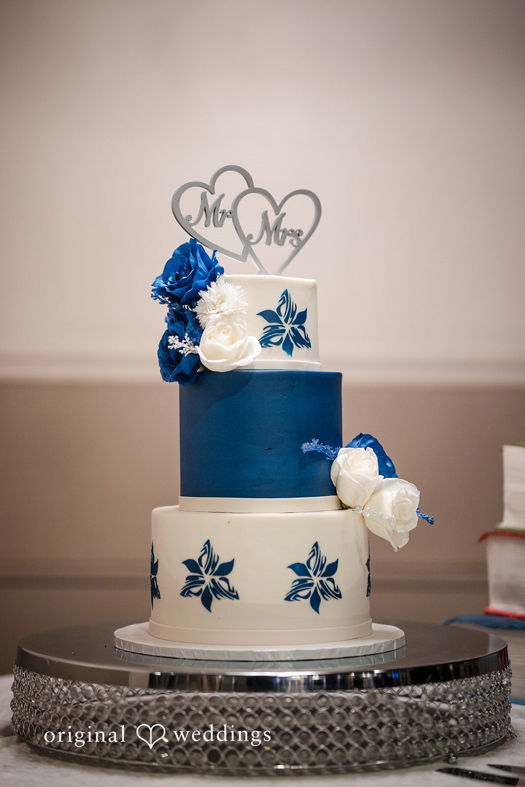Beautiful cake decorated with topper and flowers