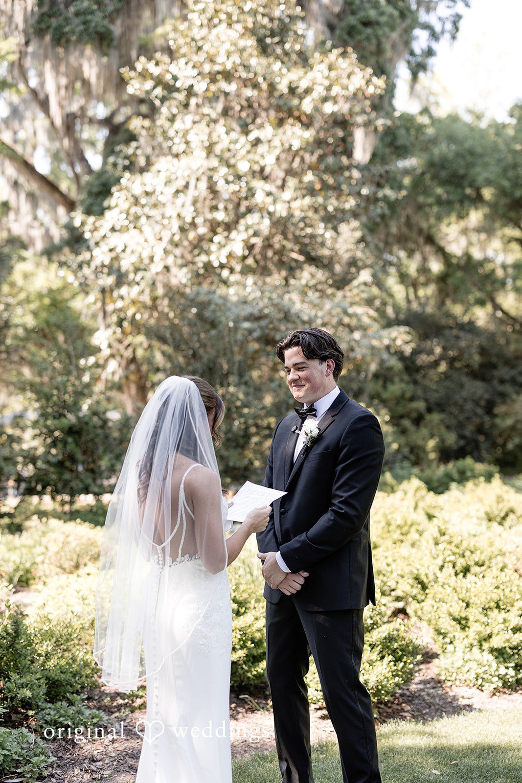 The bride reads her vows to her groom