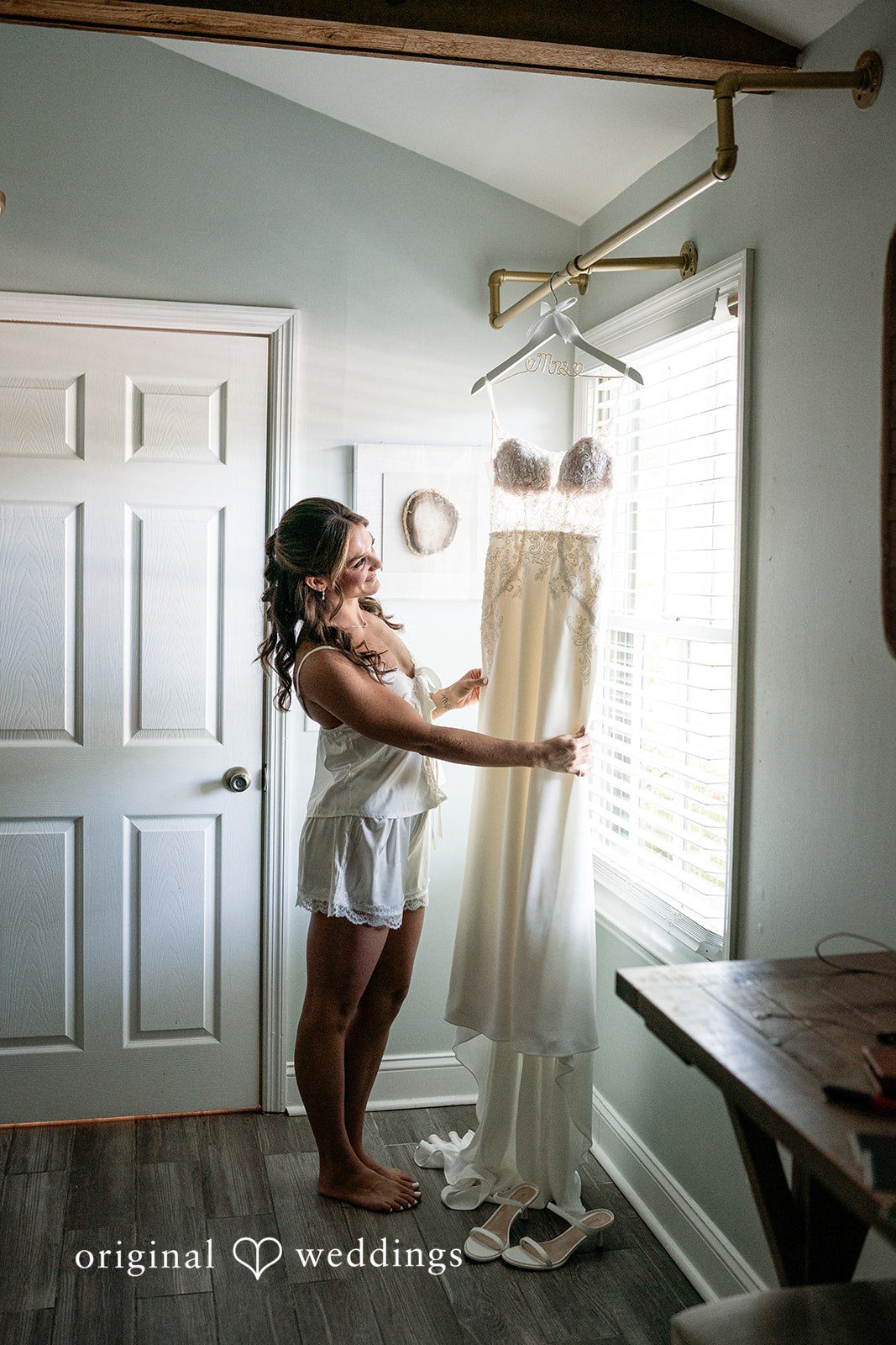 The bride checks out her gown