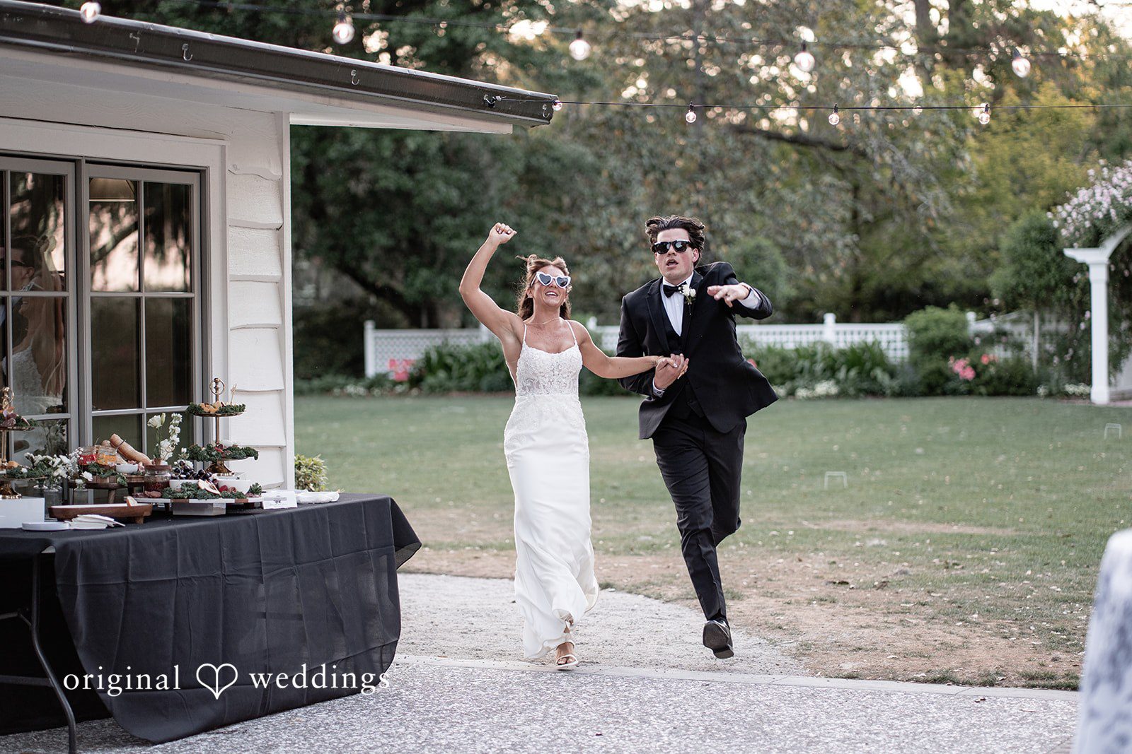 The couple makes a joyful entrance to their wedding reception