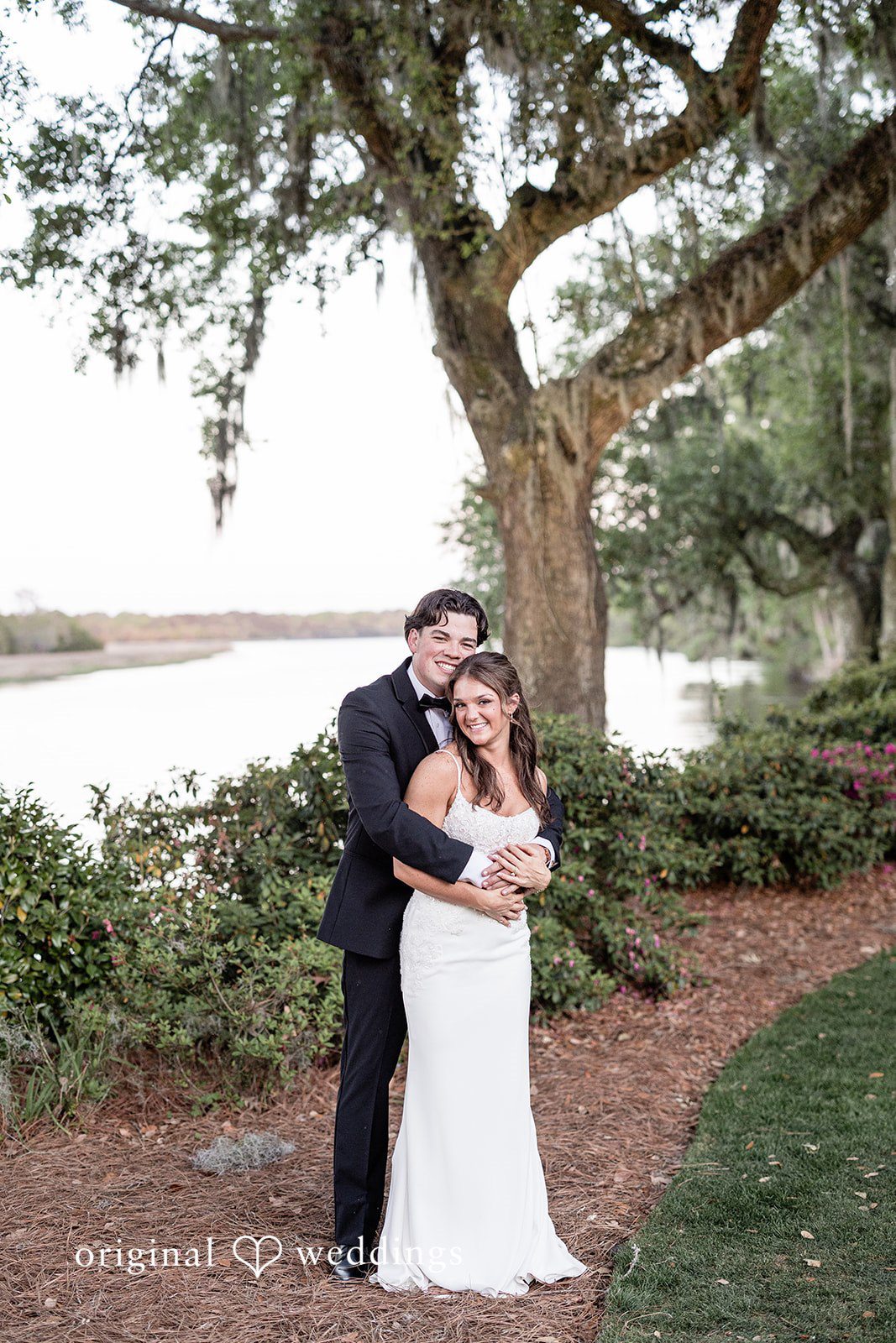 A portrait of the couple by the lake