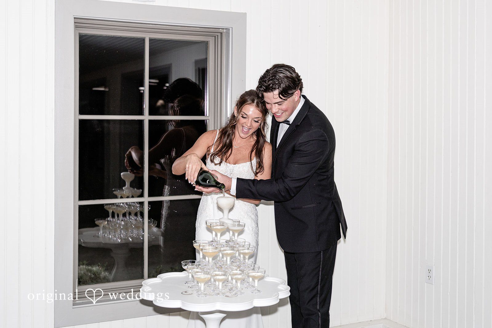 The couple shares a wine