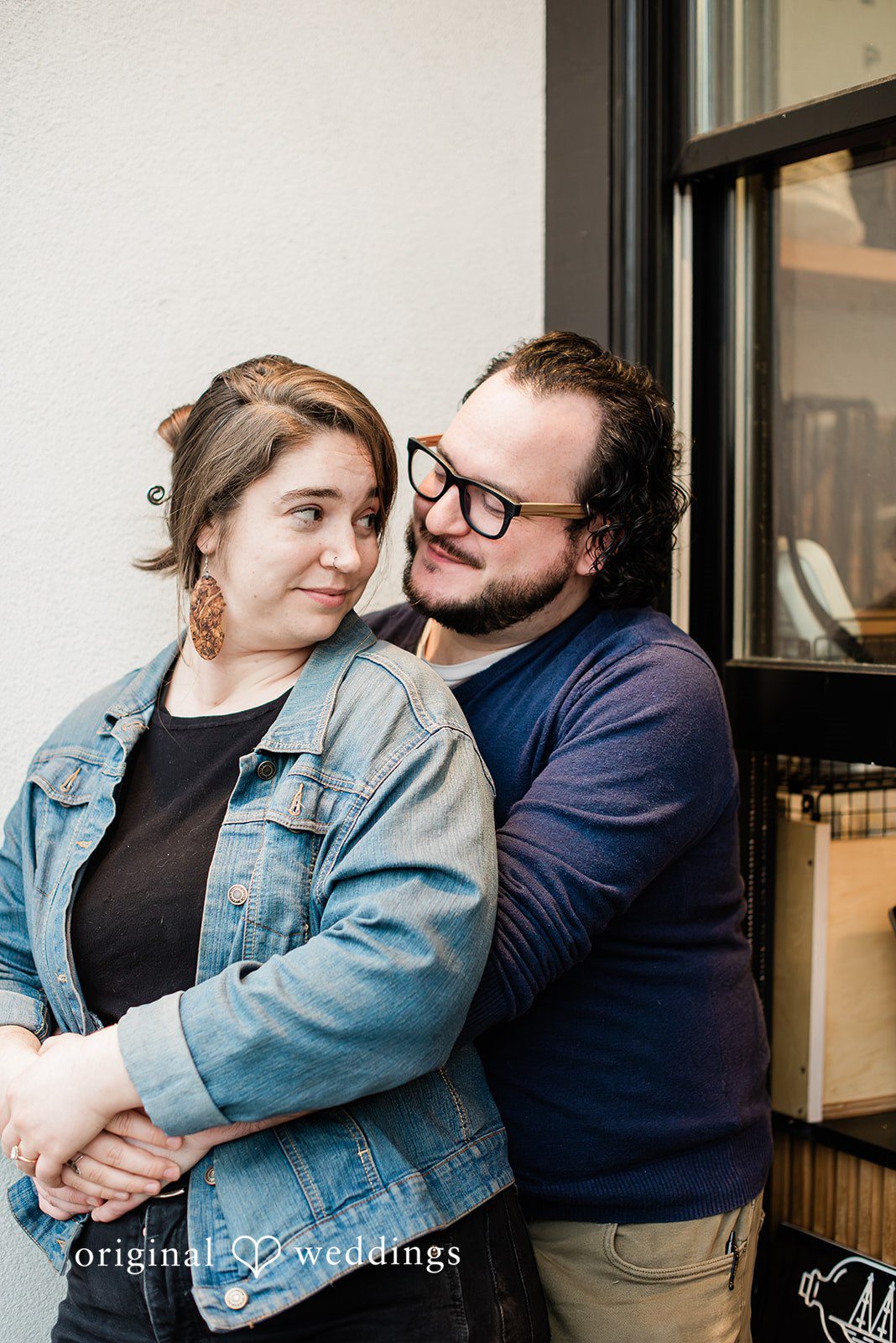 Seattle Engagement Photographers capturing a romantic couple moment outside at Mainstay Provisions