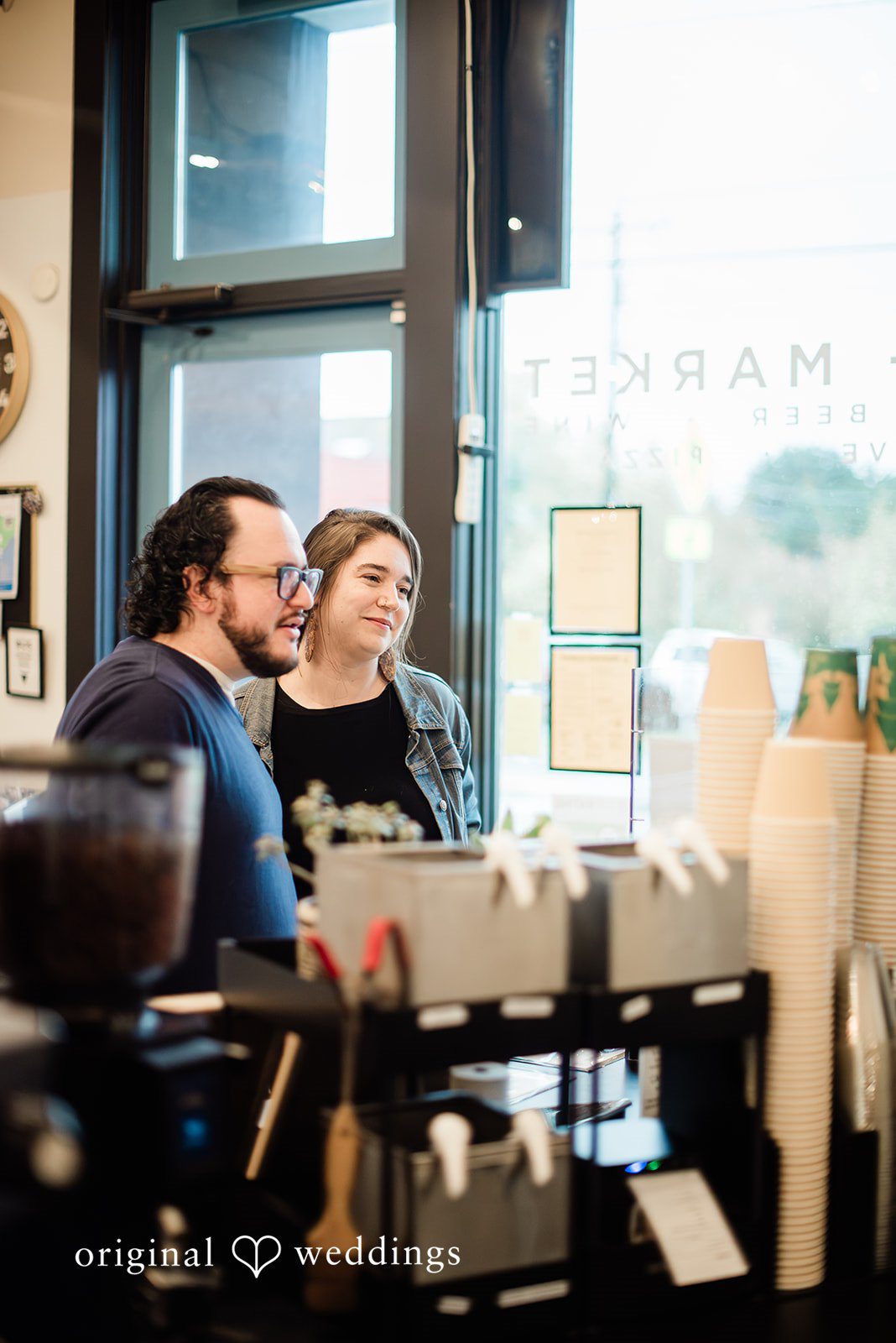 Romantic couple portrait near the window at Mainstay Provisions