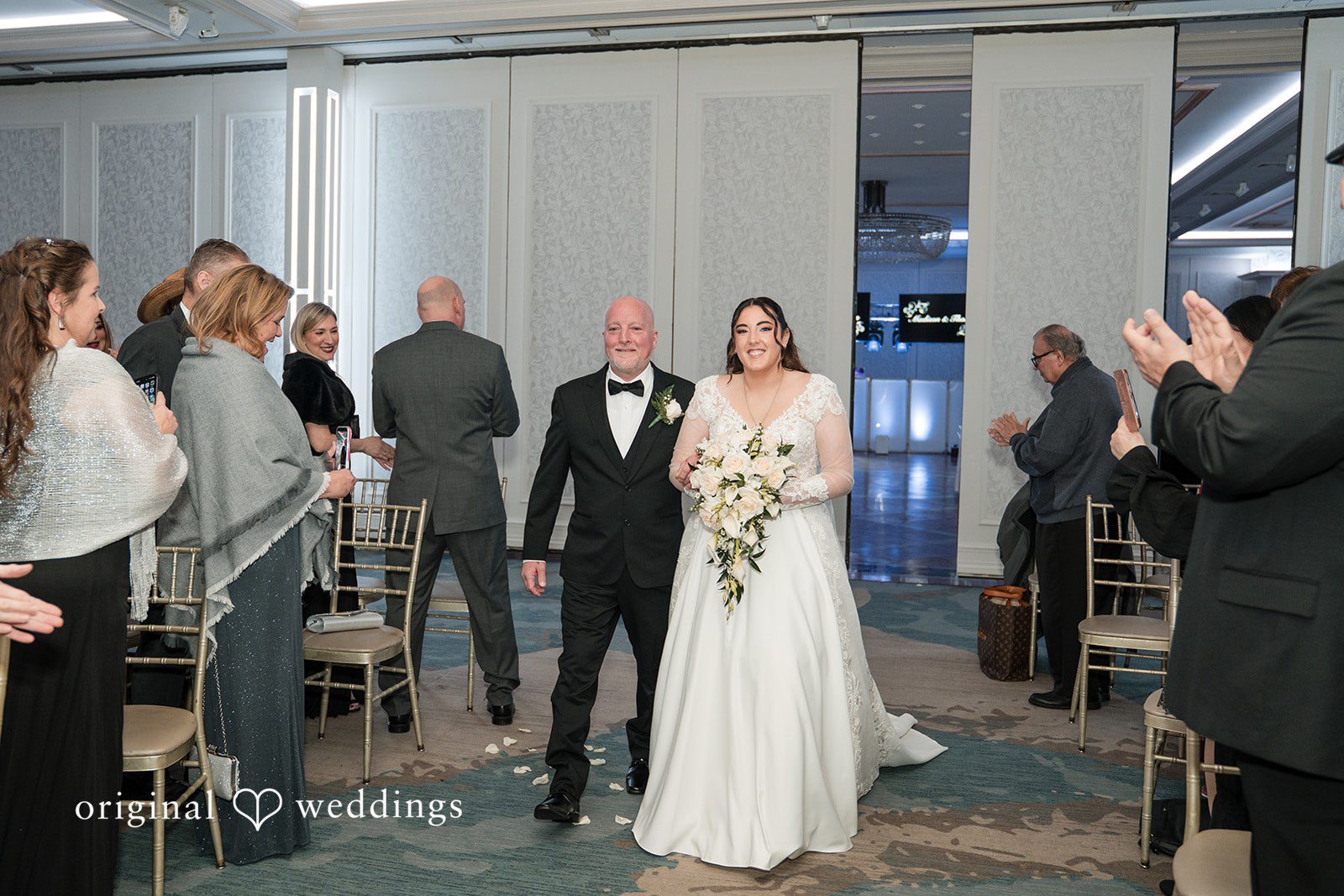 Beautiful bride walking down the aisle for ceremony