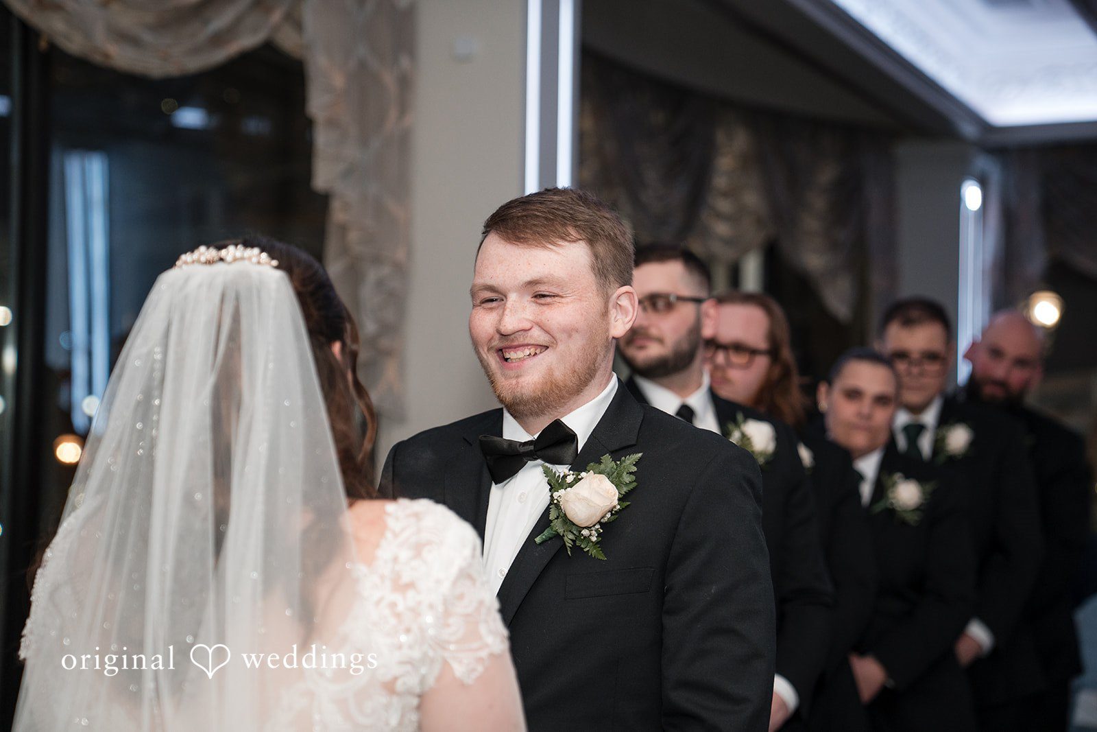 Groom looking at bride during ceremony at Marina Del Rey