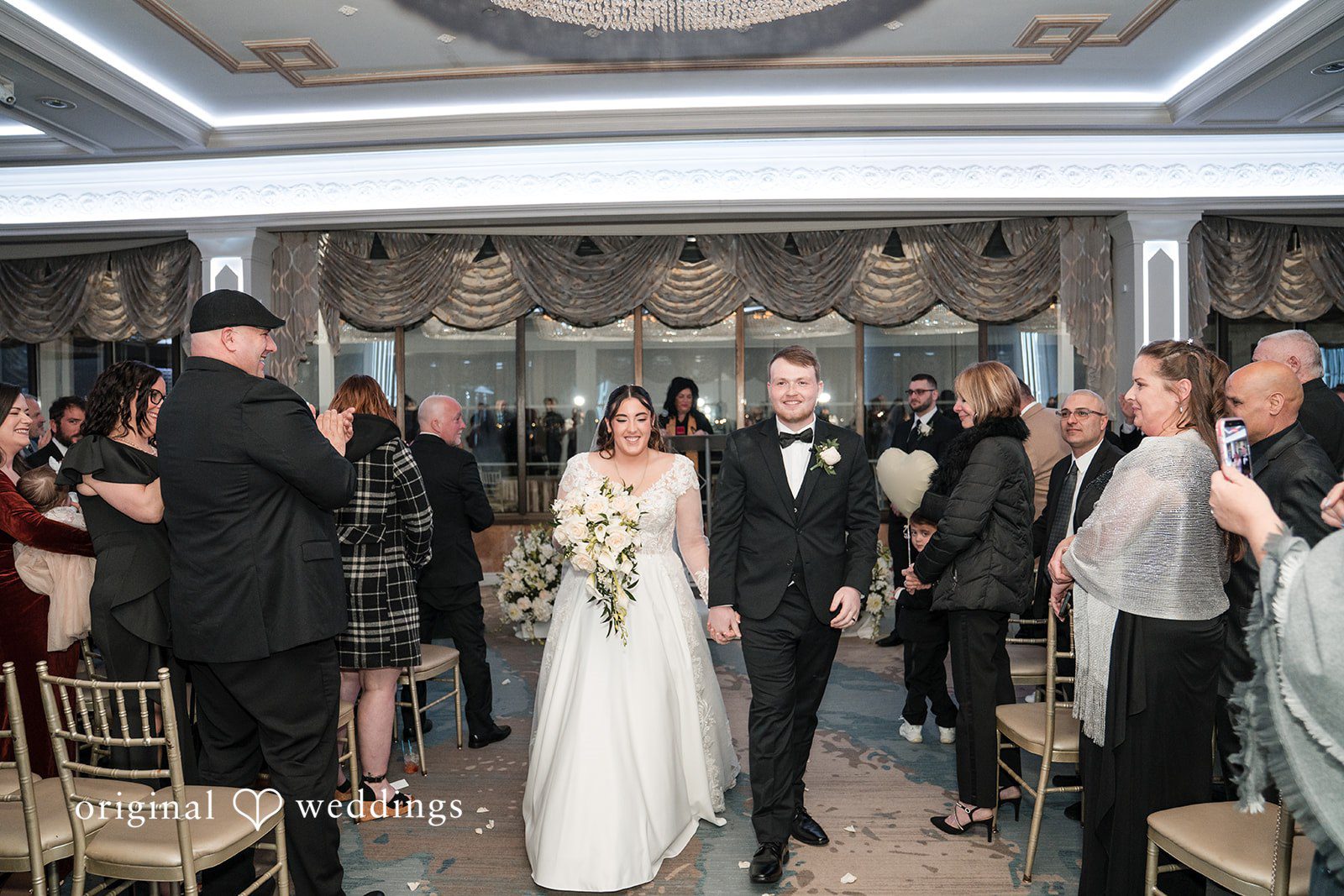 Newly married couple walking hand in hand