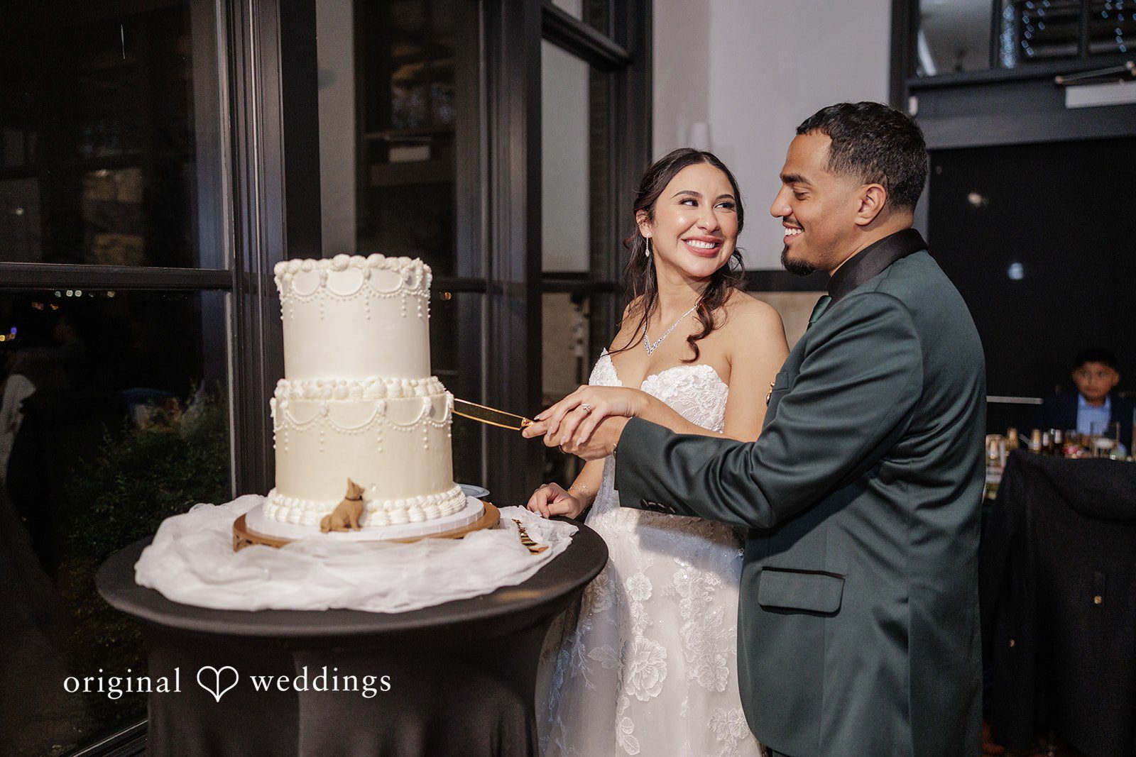 Cassandra + Benjamin The couple cuts the wedding cake