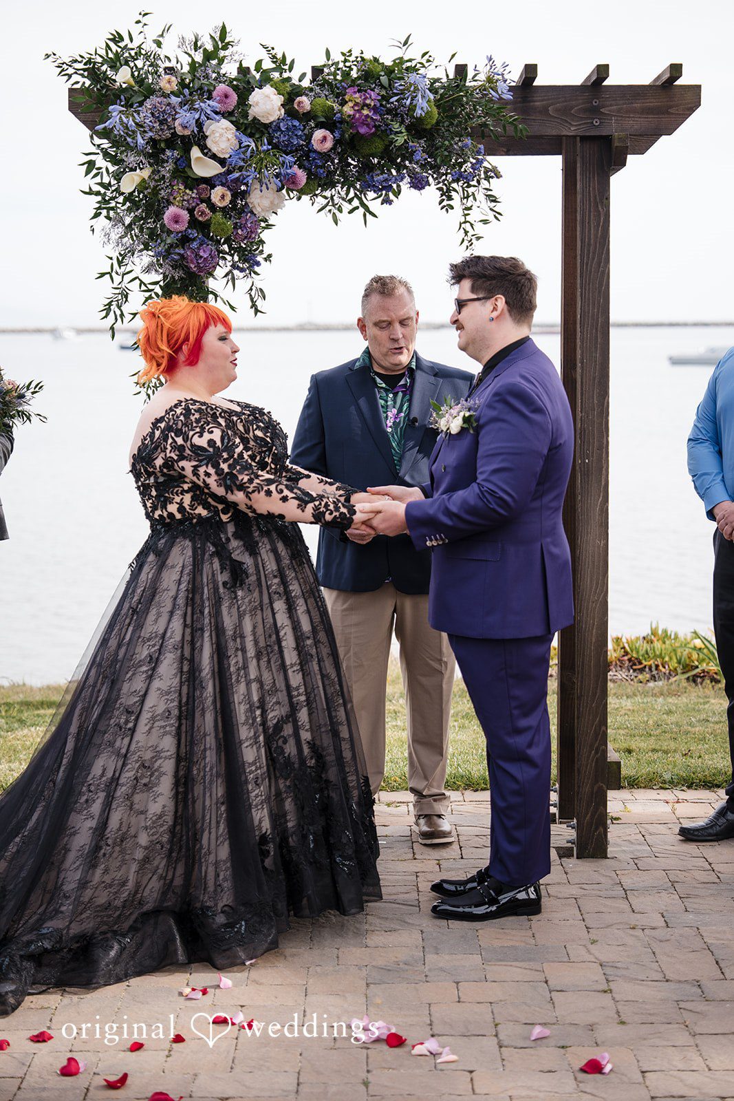 Morgan + Todd Bride and groom holding hands while sharing vows