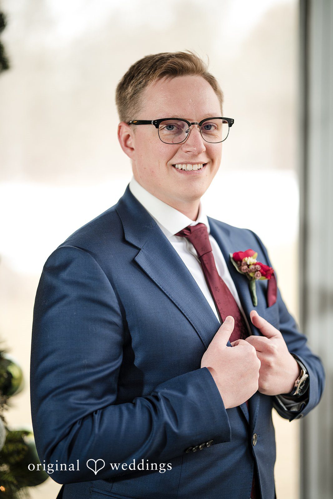 Logan + Bryan Stylish groom portrait showing elegant wedding suit details