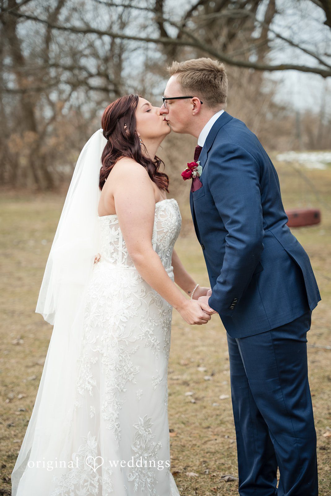 Logan + Bryan Bride and groom sharing romantic kiss after wedding ceremony