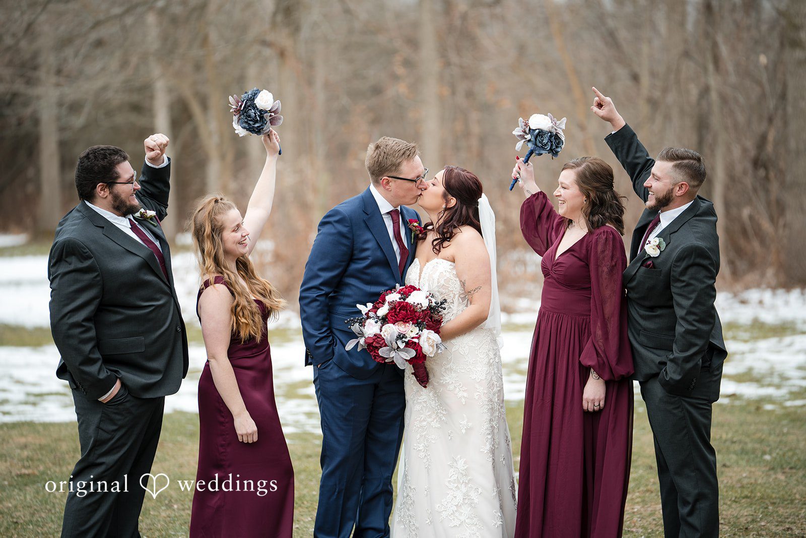 Logan + Bryan Romantic newlywed kiss surrounded by bridesmaids and groomsmen