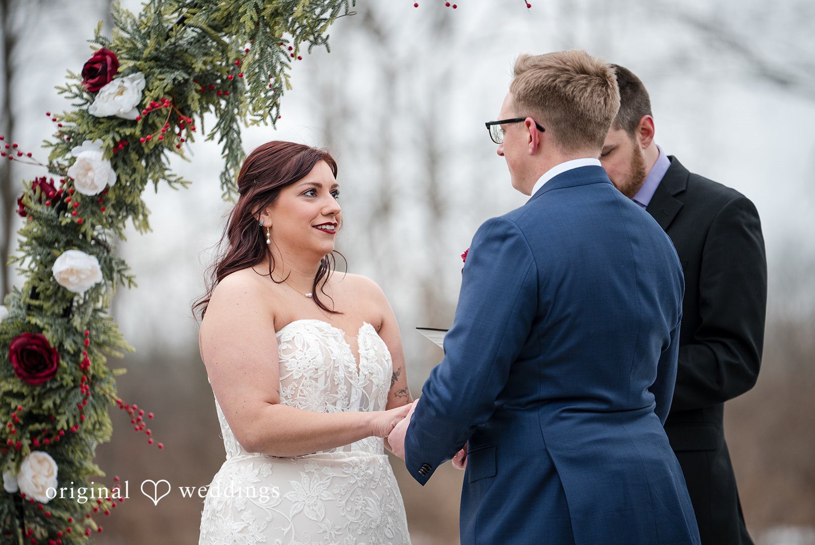 Logan + Bryan Bride and groom holding hands during emotional wedding ceremony