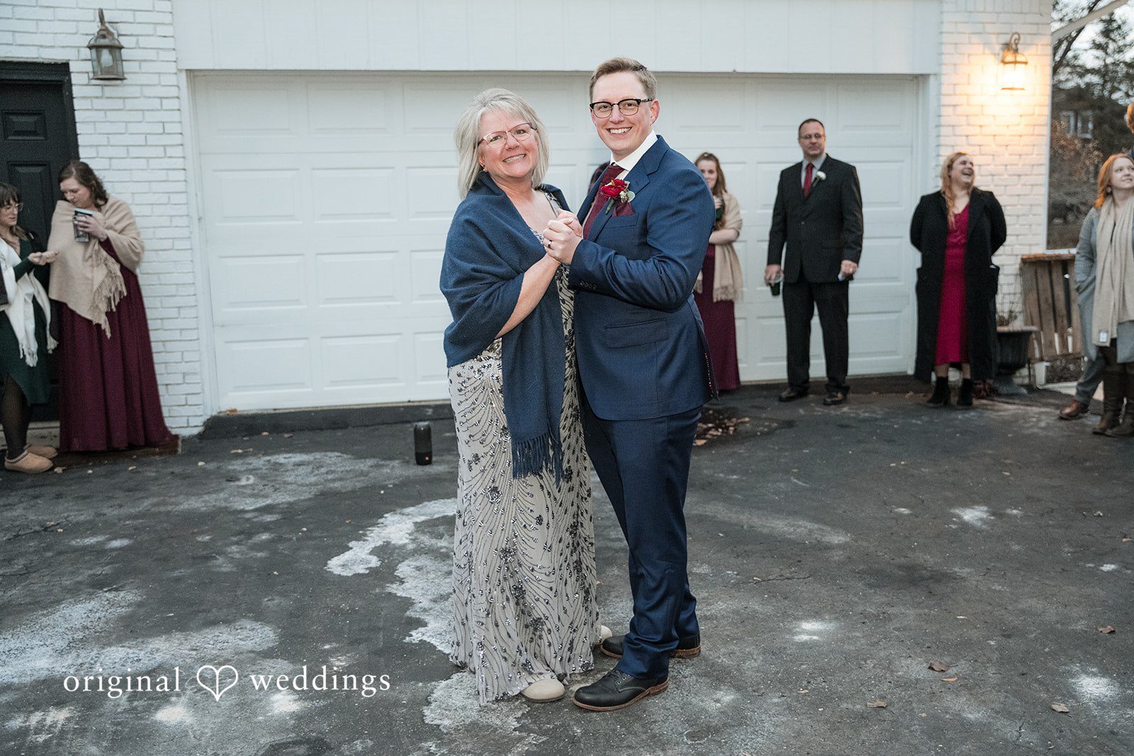 Logan + Bryan Elegant family wedding moment during winter backyard celebration