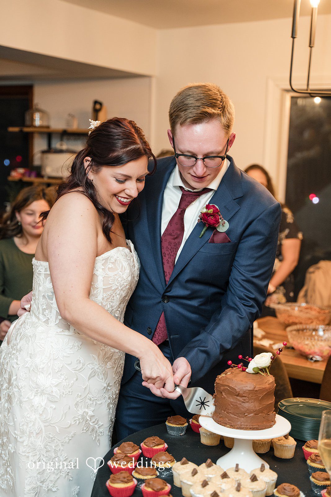 Logan + Bryan Bride and groom cutting wedding cake