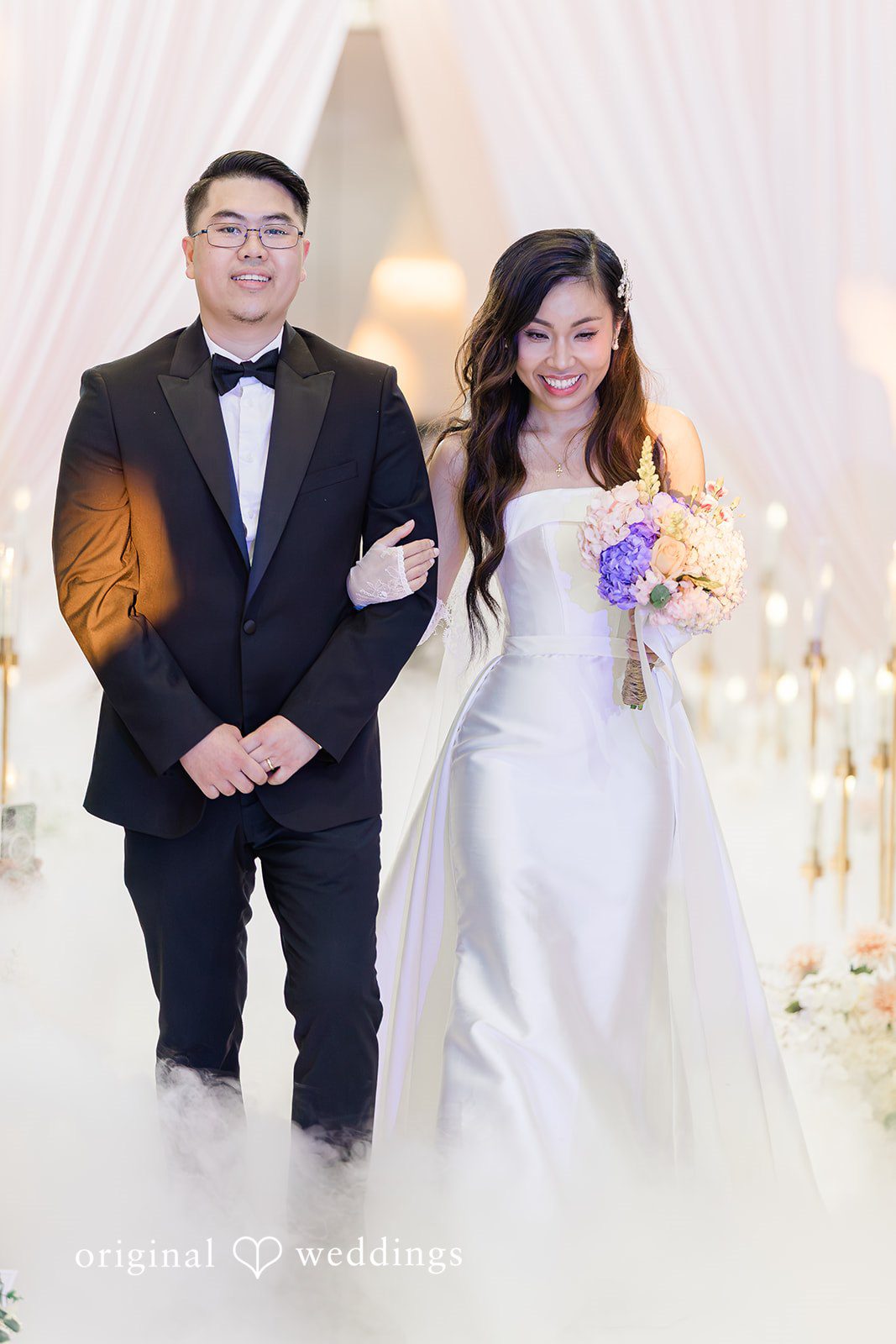 Khanh + Trung Full-length portrait of the bride and groom surrounded by elegant decor