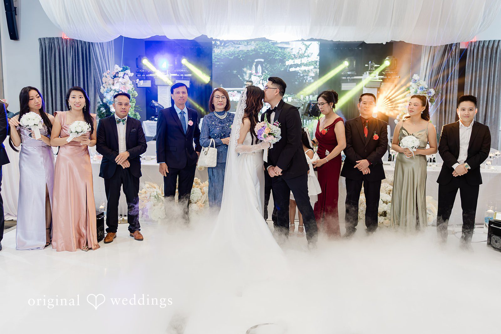 Khanh + Trung Bride and groom sharing fun moments together at the reception
