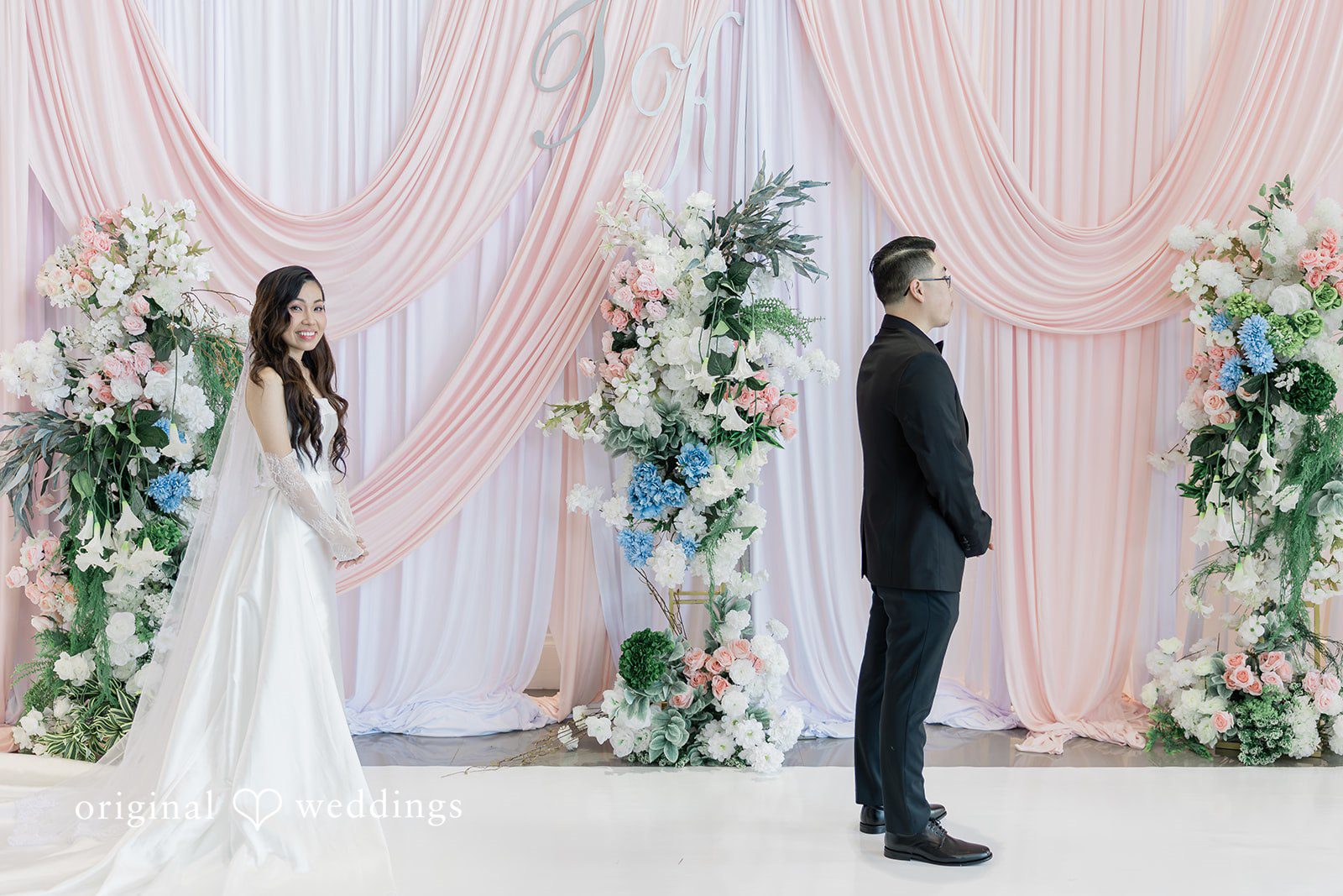 Khanh + Trung Wide portrait of the groom waiting for the bride outdoors