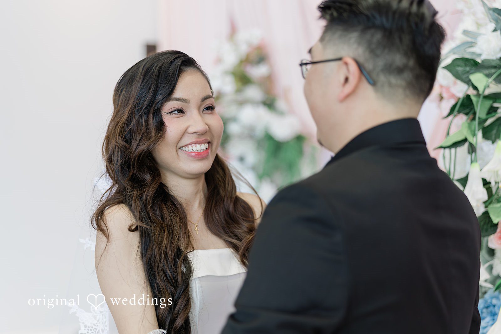 Khanh + Trung Bride and groom holding hands for the first time during portraits